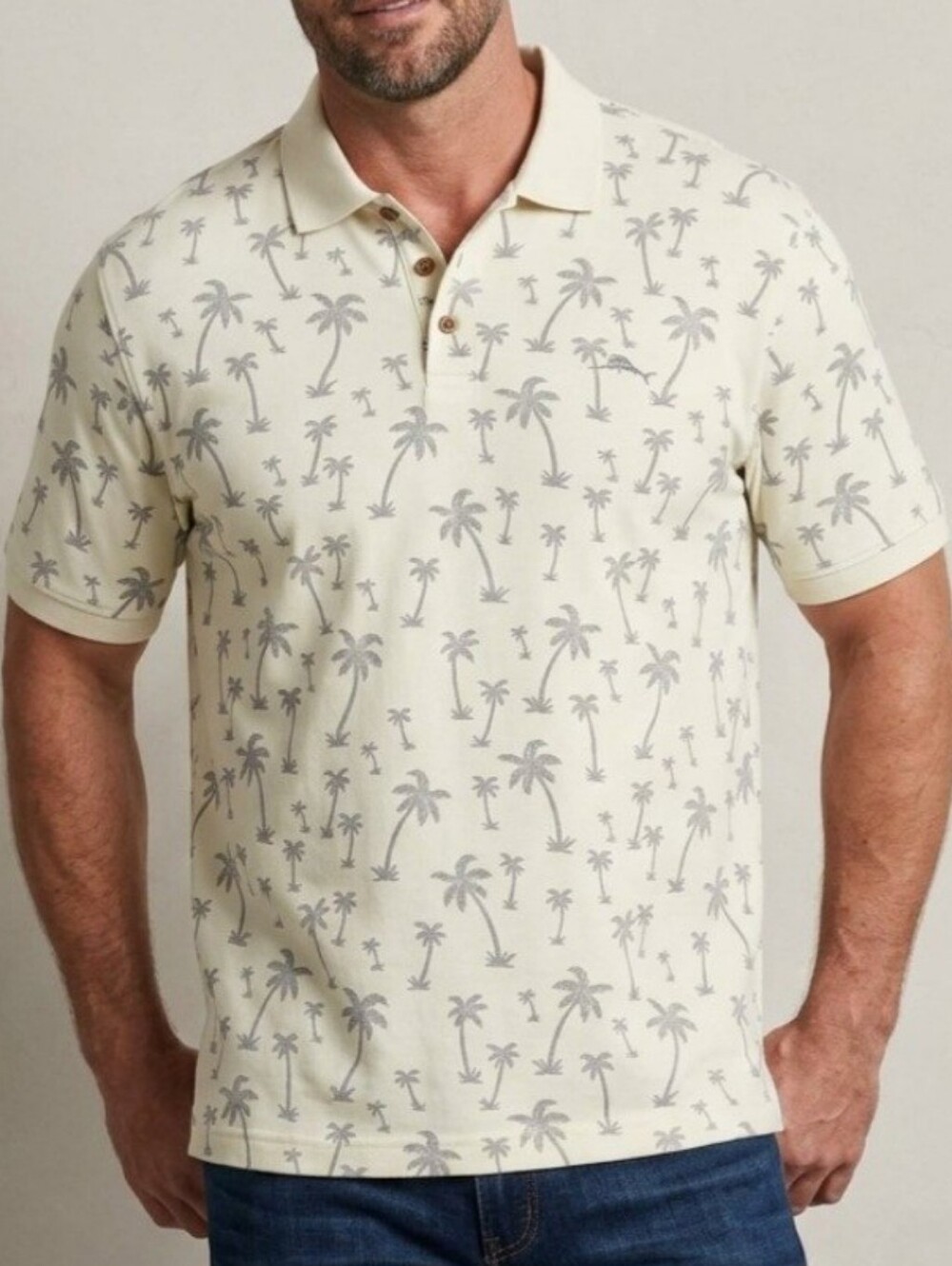 Tommy Bahama Men's Polo shirt features a distinct all-over palm tree pattern